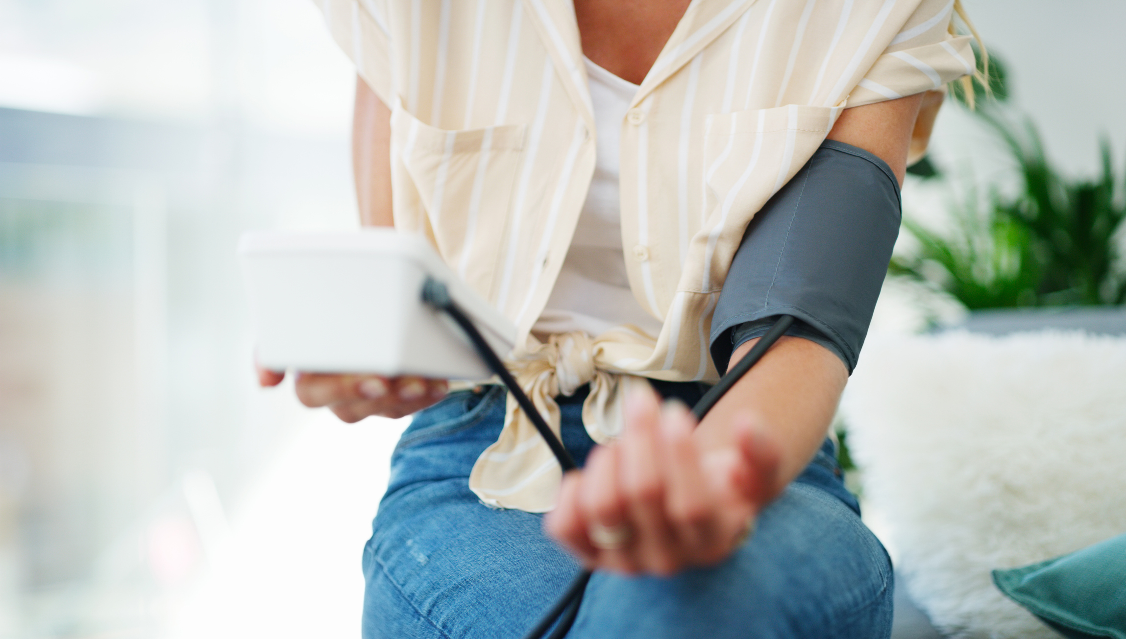 Woman taking blood pressure