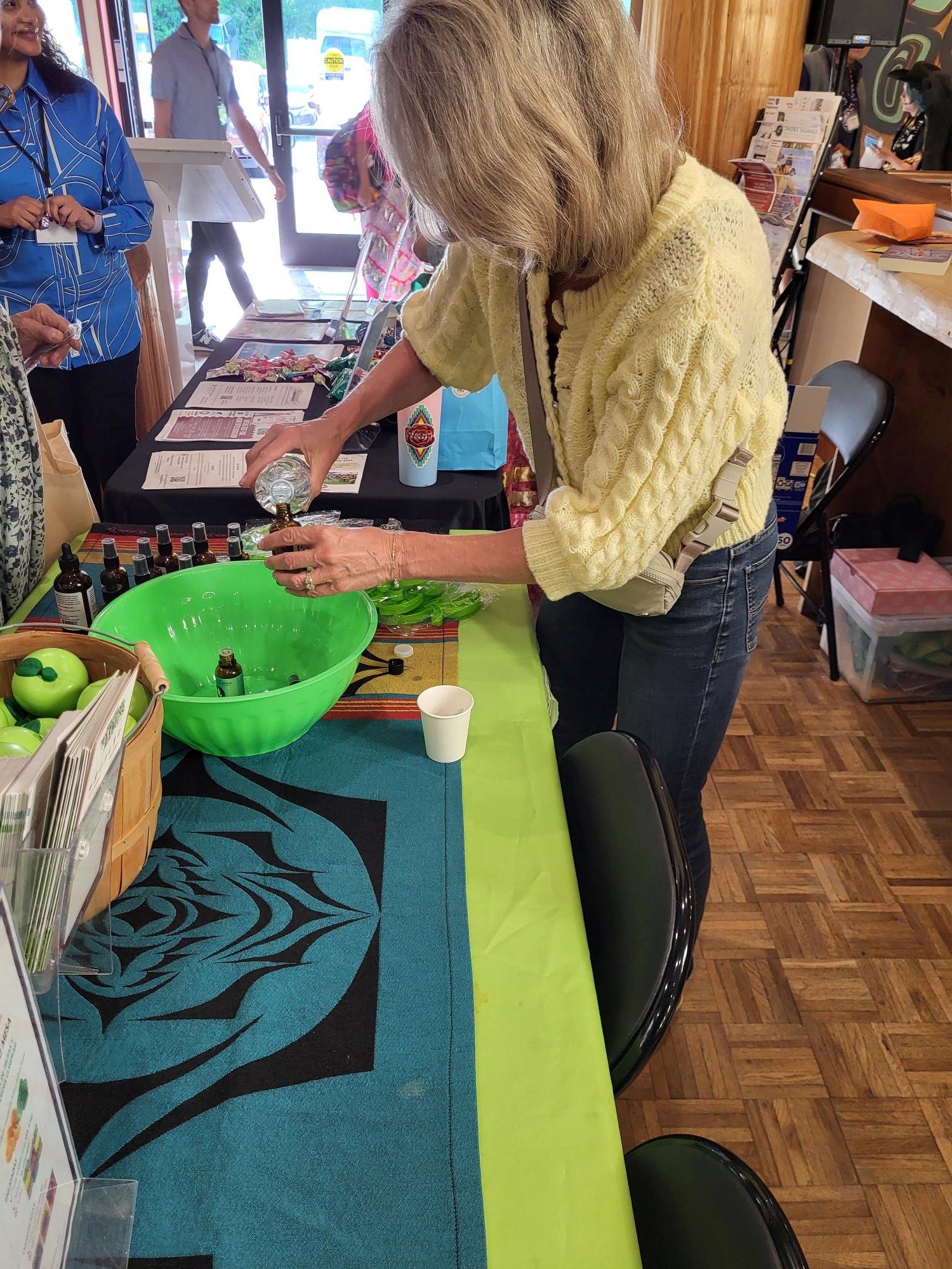 female setting up table for powwow